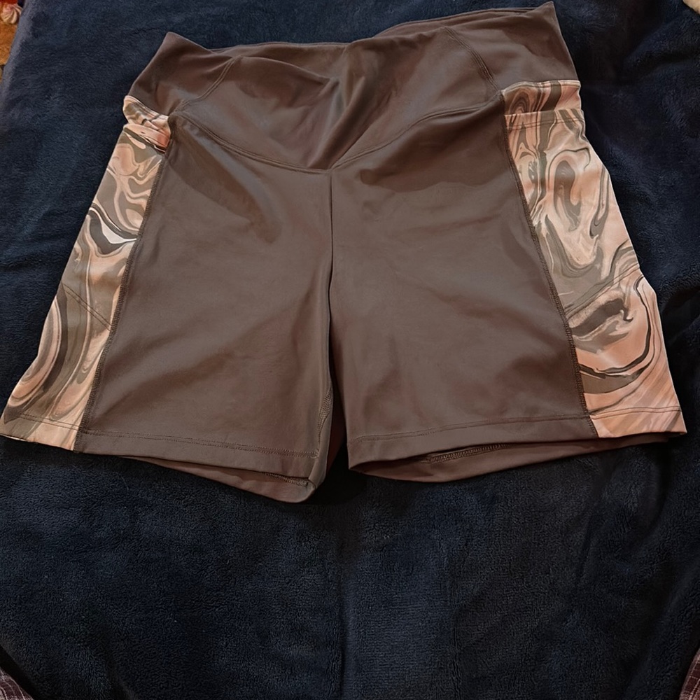 biker shorts with side pockets and design on sides.